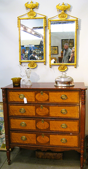 On the formal side, Rick Setser brought this four-drawer Sheraton chest, possibly New Hampshire, priced at $3400, and a pair of gilded Regency mirrors, $2800.