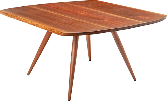 George Nakashima (1905-1990), carved walnut dining table, 1956, unmarked, a freeform table with two beveled edges, raised on four turned wood attenuated legs, 28½
