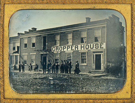 Half-plate daguerreotype of the Cropper House Hotel in Manchester, Ohio, sold for $4300 (est. $3000/5000). The catalog notes, “The Cropper House was a two-story brick hotel operated by M.V. Cropper in Manchester, Adams County, Ohio. The image dates to the early 1850s, consistent with both the daguerreotype process and the hotel’s listing in W.W. Reilly and Co.’s Ohio State Business Directory for 1853-54, which places M.V. Cropper and the Cropper House in Locust Grove, Adams County. The 1858 brick building visible here was constructed by Cropper on the same foundation as an earlier frame structure that burned, and the hotel later passed through several proprietors before becoming the Manchester Hotel, which itself was destroyed by fire in January 1910.” Michael Lehr Antiques, Rockaway, New Jersey, September 19.