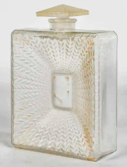 According to an auction house spokesperson, this colorless square perfume bottle was literally rescued from the trash. It is a 1925 bottle by renowned French art glass designer René Lalique (1860-1945) for Houbigant’s La Belle Saison perfume. The bottle is 5½