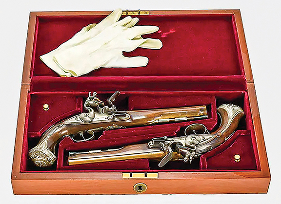 These cased silver-mounted flintlock pistols are from the United States Historical Society and were manufactured for the U.S. bicentennial. The pistols are replicas of those belonging to George Washington. These pistols are numbers 629A and 629B from an edition of 975. The set sold for $2048 (est. $1000/1800).