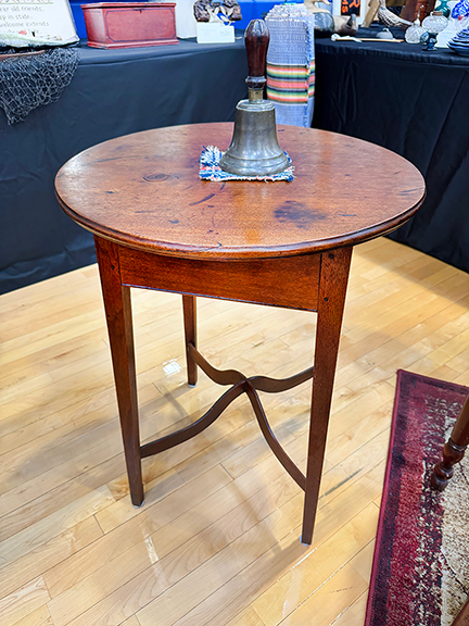 A walnut table, 1810-20, was tagged $3200 from James and Nancy Glazer of Bailey Island, Maine. The 28