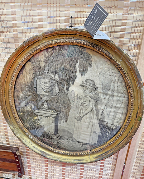This black-and-white silk-on-silk needlework mourning picture, often called printwork because it mimics prints,1790-1820, was $1200 from Thomas R. Field Antiques, Northfield, Maine. The name on the memorial depicted is Werter.