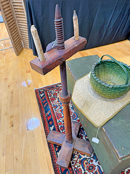 This 1740-60 maple double-socket adjustable light stand with a cross base and original surface stands 36