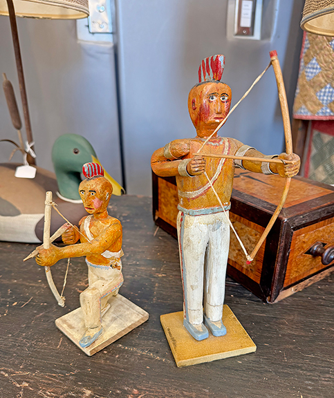 These two carved folky figures (left), probably from the 1950s, were once in the collection of Beverly Archer (b. 1948), a writer and actress who appeared on television&rsquo;s Mama&rsquo;s Family and Major Dad. The figures were tagged $525 from Christopher Stanley of Christopher Stanley Antiques, Bremen, Maine, who joked that it was appropriate that the figures were archers. Stanley also had an 1890s painted whirligig with glass eyes. From a collection in Harrington, Maine, it was priced at $825.