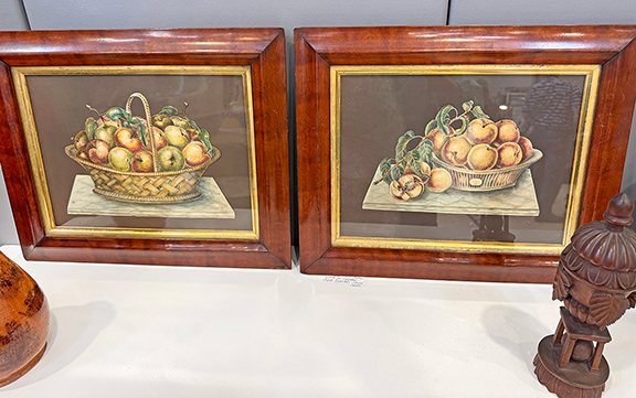 This pair of prints is not exactly theorems; rather they are cutouts of watercolors depicting baskets of fruit. One is dated 1844. John Sideli Antiques & Fine Art, Bristol, Rhode Island, asked $1200 for the pair.