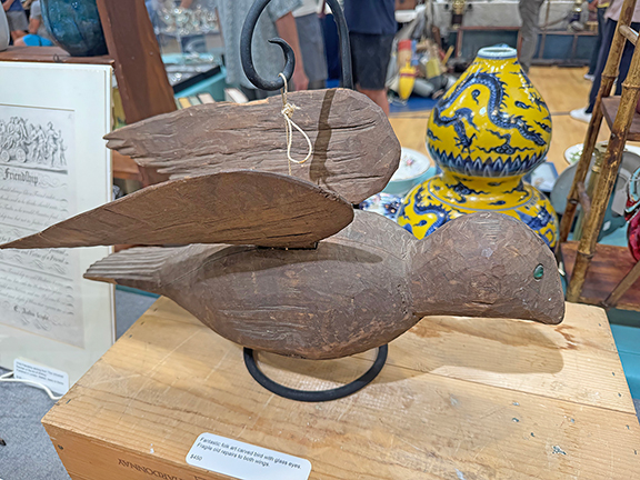 This folk-art carved bird with glass eyes had repairs to both wings and was $450 from Joel White of Curiosity Antiques, Waldoboro, Maine.
