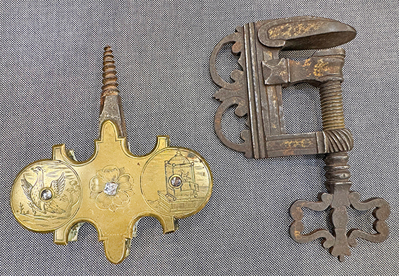 Ross Levett of Ross Levett Antiques, Thomaston, Maine, offered a rare Dutch implement (left) with engraved scenes of a bird and a bird in a cage. Levett said the 18th-century tool was used to raise and lower bird cages, and he asked $2500. The 17th-century clamp, right, was once gilded and was priced at $1600.
