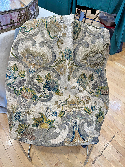 This 17th-century Belgian needlework cope, a long cloak worn by religious clergy, measures 43