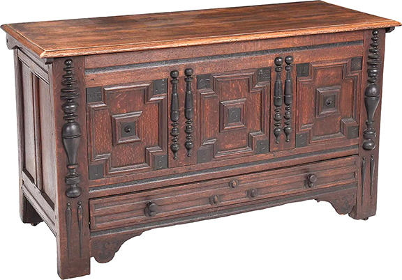 This paneled oak lift-top chest has the dramatic inscription “The 19 of the 11 MO 1685 G I P” across the front of the chest. The 30¼
