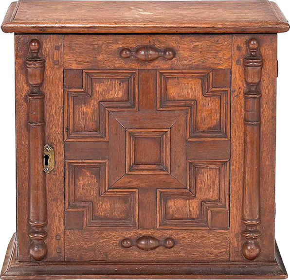 Brunk catalogers speculate that this is one of only two examples of a paneled oak valuables cabinet from the Boston shop of Mason and Messinger, 1660-90. The extremely rare 16½