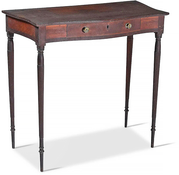 This New Hampshire mahogany dressing table, with a crazed, dark early surface, is attributed to Portsmouth, 1800-10. The delicate table with serpentine top and extremely thin reeded legs sold on Brunk Live for $15,000 ($5000/7000). It had sold at Eldred’s on March 30, 2001, for $72,900, and Wayne Pratt had the 33¼