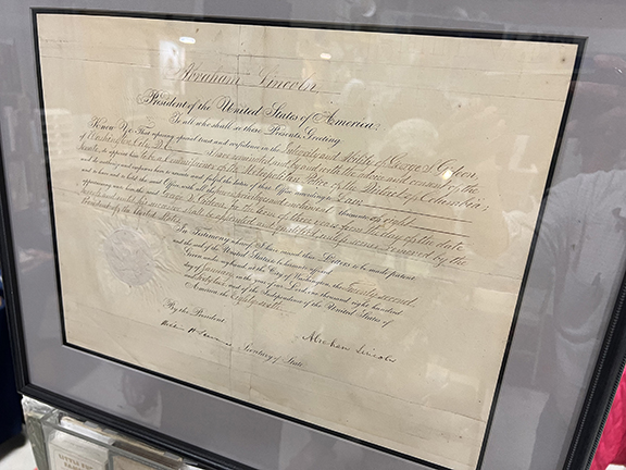 Richard Mori of Mori Books, Franklin, New Hampshire, posing with an 1862 document appointing George S. Gideon to be the commissioner of the Metropolitan Police of Washington, D.C. This Civil War-era piece bears the signatures of President Abraham Lincoln and Secretary of State William Henry Seward. A rare find for antiques hunters and history lovers, it was $14,000.