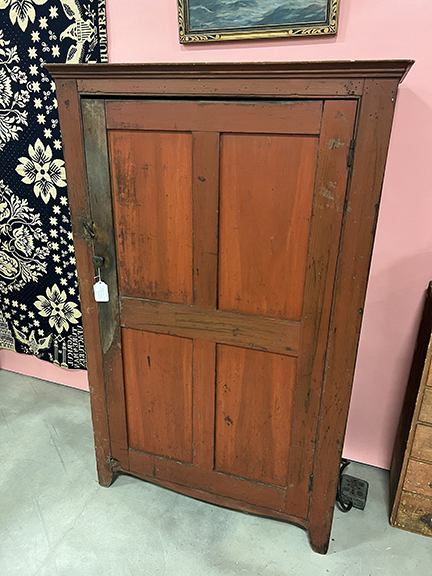 The one-door cupboard in old red paint was $850 from Goosefare Antiques & Promotions, Saco, Maine.