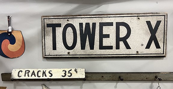 This “Tower X” sign from DocEngine Antiques, Holliston, Massachusetts, was a source of mystery to owner Jim Luskay, who did not know precisely what it refers to. We thought it might have come from a railroad. It was $195. As for the “CRACKS 35¢” sign, he conjectured that it perhaps hung on a lobster shack or was used by “a cheap chiropractor.”