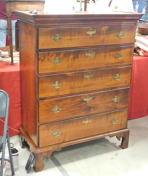 Among Martin Ferrick’s assortment of elegant furniture was this New England Chippendale chest with five graduated drawers in figural maple, standing on a short, scroll-cut base. The Lincolnville, Maine, dealer and furniture restorer was looking for $1950 for it.