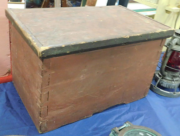 It’s not fancy, but this small Queen Anne period storage chest has a lot going for it: large hand-cut dovetails, original hand-forged wrought-iron snipe hinges, lots of old rosehead nails, and plenty of the original very dry red and green paint remaining, along with faint traces of painted initials on top. For $475 you could take it from Carl Goveia of Nauset Antiques, Eastham, Massachusetts.
