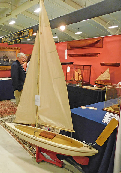 Frequently I include a measuring object as a size indicator in photographs. In this case, Dave White himself, of White’s Nautical Antiques, North Yarmouth, Maine, served the function quite well. This $1650 pond model, made by William Wadsworth of Camden, Maine, stands about seven feet tall. Wadsworth built about seven of them, and this is the only one built as a double ender with a vane steering gear.