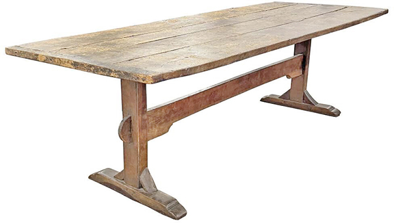 Having a four-board top and shoe feet, this trestle table with original surface sold for $2700 (est. $1000/3000). It measures 31¾