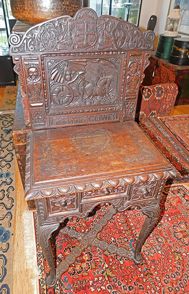 This elaborate dressing table features a full coverage carved backsplash with a chariot drawn by two winged Pegasuses, flanked by two male figures, bearing a carved inscription “LADIE FRANCES GOWER,” and a date of “1645,” but overall construction suggests it’s a late 19th-century Jacobean Revival interpretation of a famous table from the English Civil War period of the mid-17th century. The $1200/1800 estimate and the $720 selling price appear to confirm that. Sisco photo.