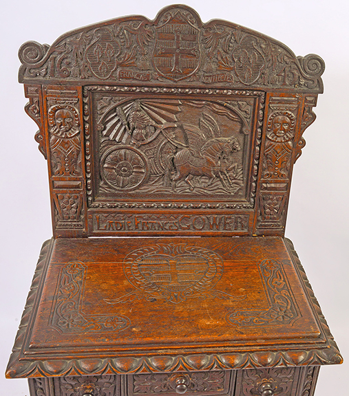 This elaborate dressing table features a full coverage carved backsplash with a chariot drawn by two winged Pegasuses, flanked by two male figures, bearing a carved inscription “LADIE FRANCES GOWER,” and a date of “1645,” but overall construction suggests it’s a late 19th-century Jacobean Revival interpretation of a famous table from the English Civil War period of the mid-17th century. The $1200/1800 estimate and the $720 selling price appear to confirm that. Sisco photo.