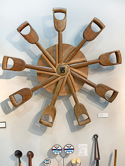 All Together Now, 2024, a spoke-like arrangement of old wooden shovel handles was inspiring, and tagged $4500.