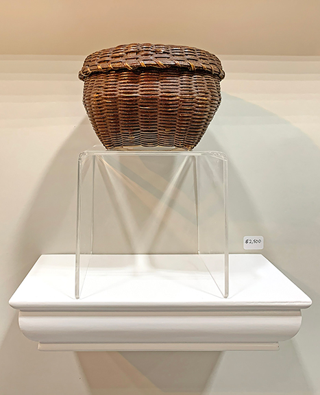 Edgerton also had a Victorian lattice work letter holder, circa 1900, in the original marbleized blue and white paint, lapped together with brass tacks. It was tagged $2750. A miniature feather basket, 4&frac12;