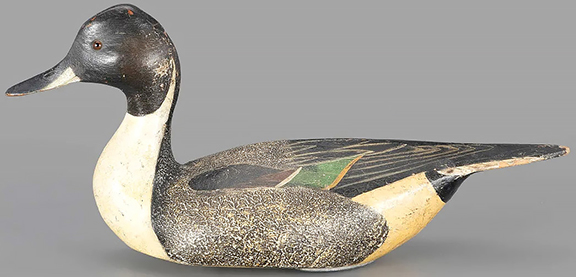 This celebrated pair of White Mallard Club pinch-breasted pintail decoys by brothers Lemuel Ward and Stephen Ward, circa 1932, each estimated at $80,000/120,000, sold separately; the drake (left) brought $108,000, and the hen, $103,200, for a total of $211,200. They were acquired from Abercrombie & Fitch by the White Mallard Club, Butte Sink, California. 