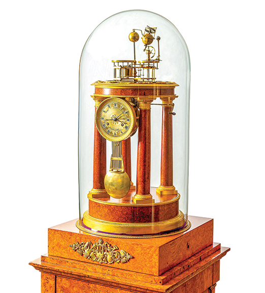 Circa 1820 orrery and music box by Parisian Zacharie-Nicholas-Amé-Joseph Raingo (1775-1847) with a two-train clock in an Empire-style case with ormolu mounts on amboyna wood. The earth revolves on its axis daily, the moon circles the earth, and the entire system turns about the sun in one year. Estimated at $150,000/250,000, it sold for $204,000 to a collector on the West Coast. “This was from a lifetime collection of a doctor in Naples, Florida. It was part of a 45-year collection of once-in-a-lifetime clocks,” said Cottone.