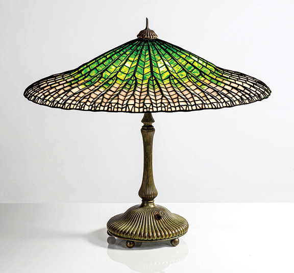 Tiffany Studios Lotus table lamp, 1900-04, leaded glass and patinated bronze, shade impressed with an early “Tiffany Studios” tag, base impressed “Tiffany Studios New York 28622,” 25