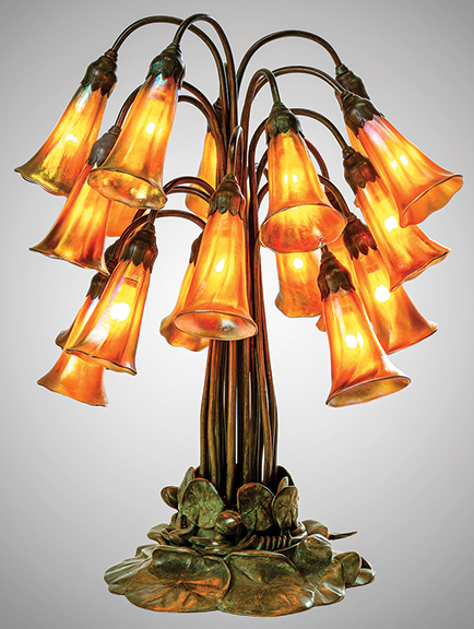 Tiffany Studios 18-light Lily table lamp, early 20th century, Favrile glass and patinated bronze, shades engraved “L.C.T.,” base impressed “Tiffany Studios New York 28626,” with Tiffany Glass & Decorating Company monogram, 20