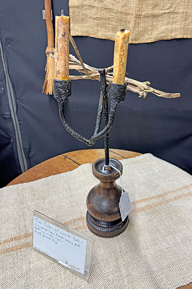 This rushlight/double iron candleholder in a turned wood base, circa 1700, was $1650 from Mary DeBuhr of Downers Grove, Illinois. DeBuhr said, “I was pleased and grateful for Deerfield this year. It’s a show that offers something for everyone in three buildings plus many outdoor tents. A great big thank you to everyone who attended, in spite of the weather forecast. Thank goodness the rain stopped during most of the show…. I was happy with my sales which were about the same as last year and much, much better than 2023 and 2024. Perhaps because of the weather I wrote sales receipts throughout the day, not just in the morning. Because I live over a thousand miles away it’s also a welcome social event for me, one I always look forward to…. The antique market truly is alive and well.”