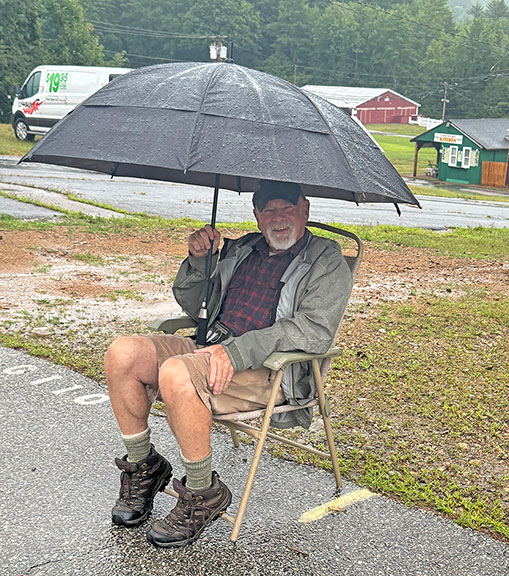 Collector Scott Cook braved the pouring rain and was first in line, already settled at 7:15 a.m., well before the 9 a.m. opening. He was in good spirits but did say his boots had gotten wet.