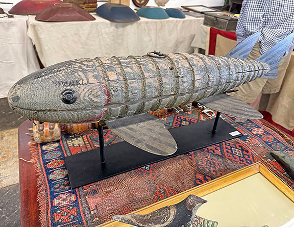 This sturgeon ice fishing decoy trade sign with a ribbed body, marked “Cund,” early 20th century, was $2850 from Firehouse Antiques, located at Buckley Mills in Rising Sun, Maryland. Owner Paul Thien said, “We were not affected by the rain. Sales were decent but many fabulous items were passed on due to pricing—perhaps a sign of the times…. Overall, the Gurleys do a great job.”