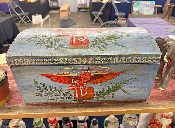 The paint-decorated dome-top box by band box makers Putnam and Hoff of Hartford, Connecticut, features an eagle with a banner reading “Putnam and Hoff Paper Hangers.” Erb’s Antiques, Lancaster, Pennsylvania, tagged it $2995.