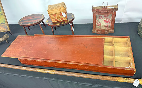 7 This large 19th-century slide-lid box seed box in original red paint was $495 from Ken and Robin Pike of Nashua, New Hampshire. In an email, the Pikes wrote, “Despite the torrential rains, we had a very good show. Sales were very close to past years, which was our goal. We sold twenty items. We felt the gate was lighter because of the weather, but it didn’t matter as far as we were concerned. The serious buyers still showed up.”