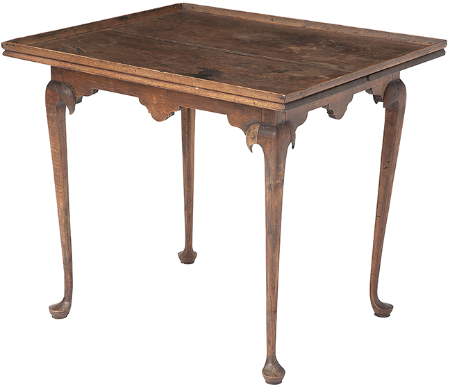 Queen Anne walnut and maple tray-top tea table by David Sherrill, East Hampton, New York, mid-18th century. The overhanging top above a shaped apron with drop pendants joins four spurred cabriole legs ending in pad feet. One of the feet has been replaced. The table was probably made for the cabinetmaker’s father, Recompence Sherrill, whose initials are incised on the underside. The 27¼