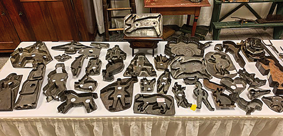 Dealer Greg Kramer of Greg K. Kramer & Co., Robesonia, Pennsylvania, gives choices. Here is a very large selection of early utensils and cookie cutters.
