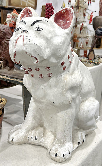 In red and white paint, this large chalkware bulldog stands 17½