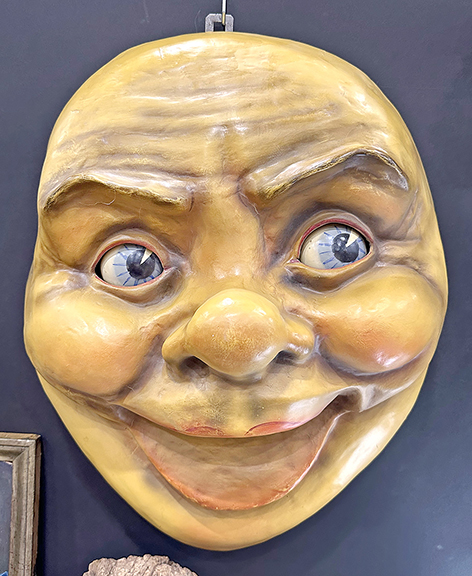 Possibly a trade stimulator, this German papier-mâché moon features blue clockwork eyes. Dating to the 1920s, measuring 19