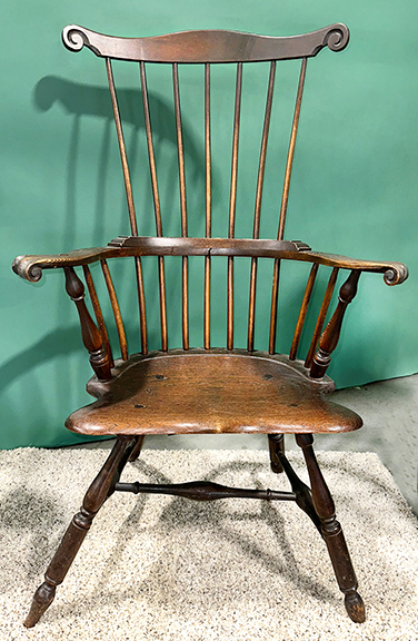 “People who collect antiques like a good Windsor,” said dealer Robert “Bob” Zollinhofer of Medina, Ohio. This comb-back armchair with carved ears, knuckle handholds, and a shaped saddle seat is certainly a good Windsor. Having a seven-spindle back and long blunt-arrow feet, the chair dates to 1780-90 and is of Maryland origin (thought to have been made between Washington, D.C., and Baltimore). It was offered for $45,000.