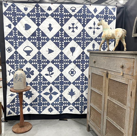 Show promoters Jill and Mark Mattingly of ForeverMore, Chrisman, Illinois, offered this blue-and-white quilt in the Sampler/Wild Goose Chase pattern, circa 1890, 85