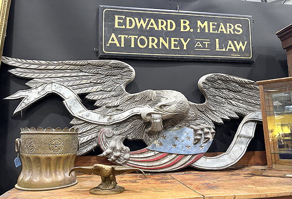 Jacob Gredy of Old House Salvage, Seymour, Indiana, offered an eclectic mix of items. The 1930s cast-zinc eagle, salvaged from a building in downtown Chicago, was marked $3200; the trench art shell, $385; and the wooden “Edward B. Mears / Attorney at Law” sign, single sided, signed “Sprague’s Paint Shop,” 13