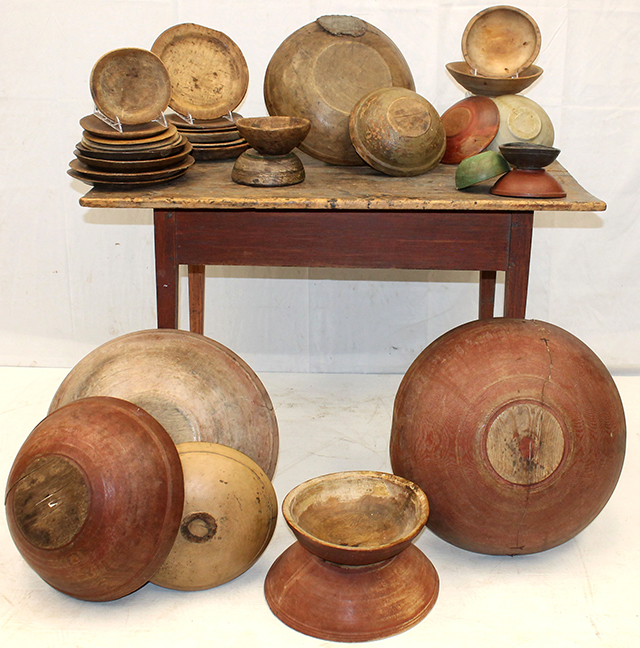 An ABUNDANCE of 18th- & 19th-century treen plates & bowls in various sizes, shapes, & paint shown on one of the many antique tavern tables