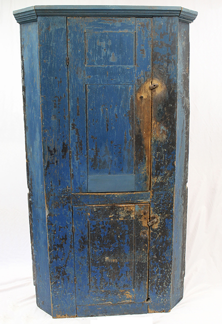 Antique corner cupboard in vibrant blue paint