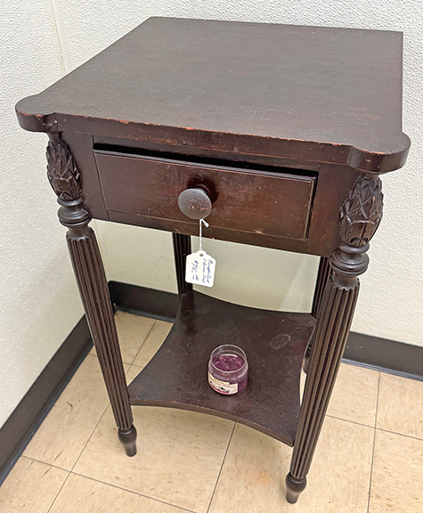 The one-drawer stand with carved pineapples was tagged $75, and was set up in the bathroom. Stephen Cyr said “I had a corner shelf in there with some toiletries—somebody bought it. I thought ‘Why not?’ No wasted space.”