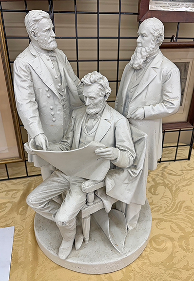 The Council of War, a sculptural group by John Rogers (1829-1904), was tagged $4500 from David and Lori Baillargeon of Swinging Bridge Auction, Huntington, Massachusetts. Figures of General Ulysses S. Grant and Secretary of War Edwin W. Stanton flank the seated President Abraham Lincoln.