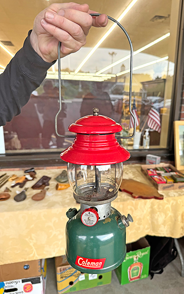 Bryan Provost of Marlborough, New Hampshire, offered railroad lanterns. From the rear: a Canadian Pacific example with an amber globe, priced at $200; New York, New Haven and Hartford with amber globe was priced at $250; and New York Central System with cobalt was priced at $250. Provost said they were never used—they were new old stock from the 1920s and 1930s. Provost also offered a Coleman 1951 Model 200A, so-called the Christmas lantern, for $750.
