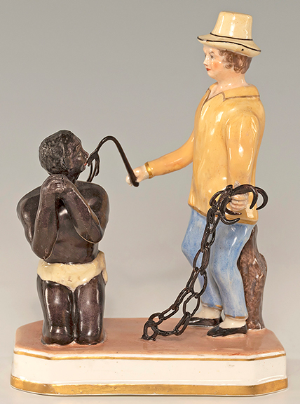 Circa 1820 Staffordshire figure of an enslaved man being whipped, 6¼