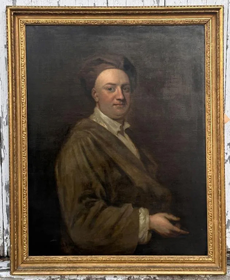 The oil on canvas portrait of London publisher and bookseller Jacob Tonson the Younger (1682-1735), attributed to William Aikman (1682-1731), after an earlier portrait by Sir Godfrey Kneller, depicts Tonson seated, his right arm outstretched, and wearing a velvet boudoir cap. Jacob Tonson the Elder, Jacob’s uncle, was also painted by Kneller in a very similar pose but holding a book in his right hand. This 35